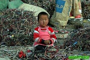 a-chinese-child-sits-amongst-a-300x200-9731193
